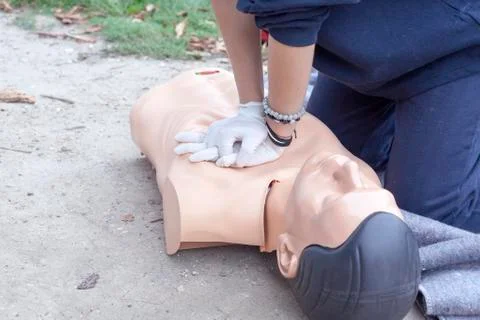 Paramedic demonstrates cpr on a dummy Stock Photos