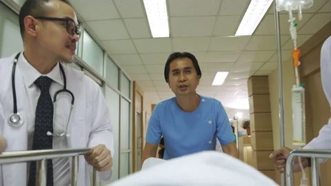 Paramedic doctors running with stretcher bed to hospital Stock Footage 165365369