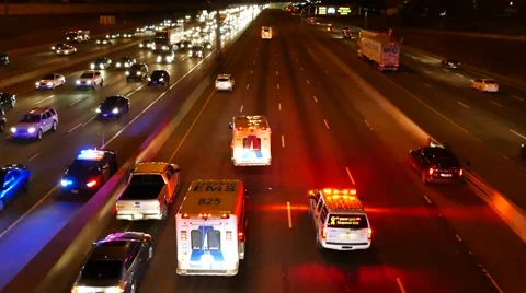 Paramedic doing chest compression in ambulance while parked on highway Stock Footage 48668980