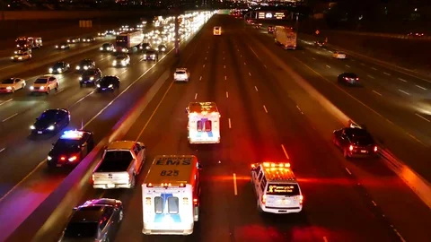 Paramedic doing chest compression in ambulance while parked on highway Stock Footage 77892715