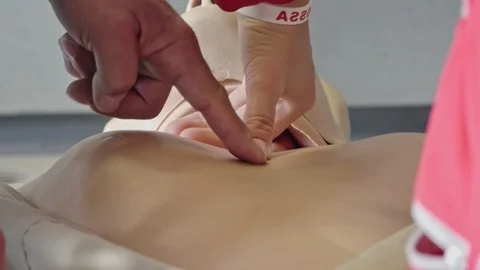 Paramedic Execute CPR on Dummy Stock Footage 100513427