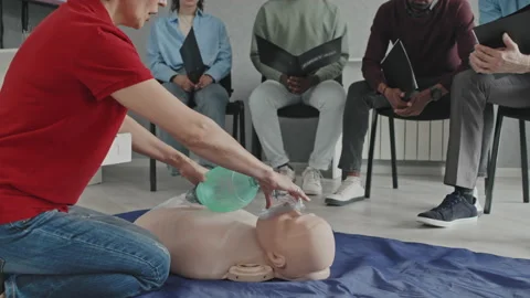 Paramedic Giving CPR Lesson Stock Footage 223934708
