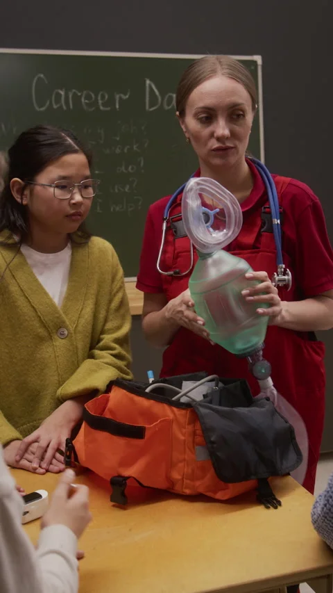 Paramedic Giving Interactive Presentation in School Vertical Stock Footage 328326061