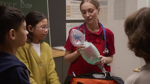 Paramedic Giving Interactive Presentation in School Stock Footage 328327347