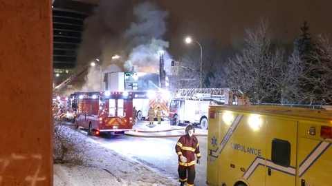 Paramedic going into ambulance at scene of fire in Montreal Stock Footage 85366635