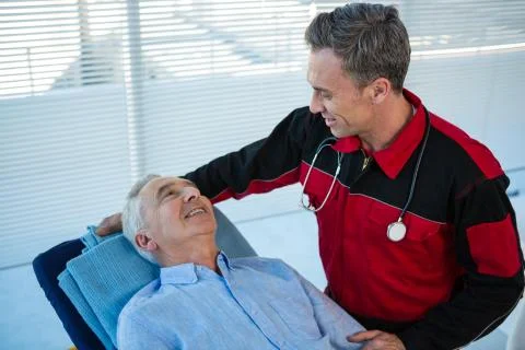 Paramedic interacting with patient Stock Photos
