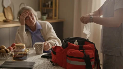 Paramedic Opening Paramedic Response Bag and Putting On Latex Gloves Stock Footage 335883915