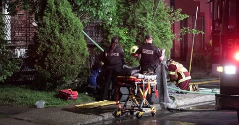 Paramedic perform CPR on a firehouse victim Stock Footage 76887997
