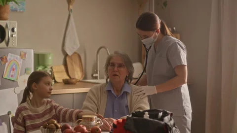 Paramedic Performing Auscultation with Stethoscope Stock Footage 335885016