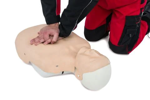 Paramedic practising resuscitation on dummy 写真素材