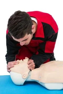 Paramedic practising resuscitation on dummy Foto stock