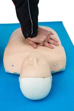 Paramedic practising resuscitation on dummy Foto stock