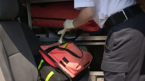 Paramedic preparing and putting on latex gloves Stock Footage 84734842