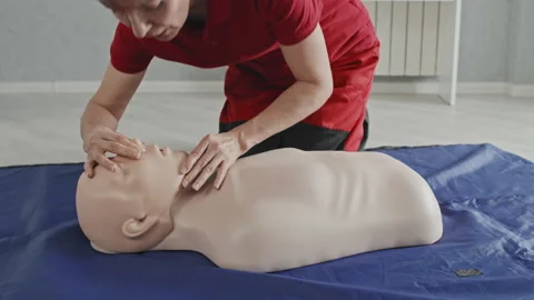 Paramedic Specialist Demonstrating CPR Stock Footage 223929321
