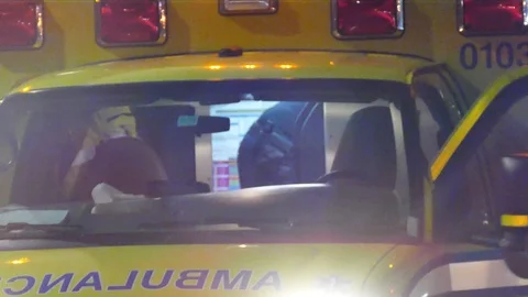Paramedic taking care of patient inside ambulance Stock Footage 119902872
