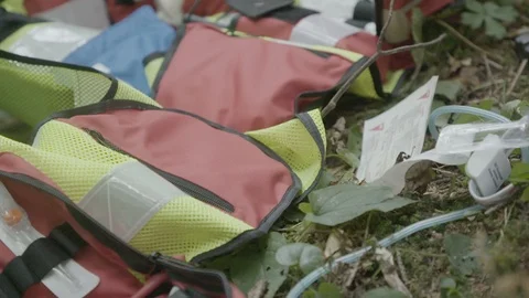 Paramedic taking  equipment from jacket Stockbeeldmateriaal 99807445