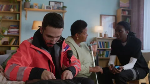 Paramedic Taking Vials from First Aid Bag while Colleague Talking to Patient Stock Footage 318900885