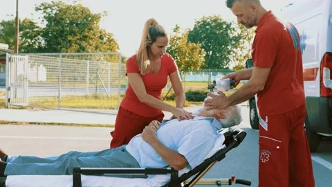 Paramedic team performing a CPR Stock Footage 211819919