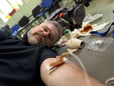 Paramedic Training Scenario Man with IV Line Emergency Simulation Indoors Stock Photos