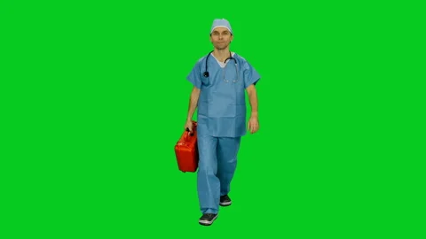 Paramedic in uniform walking with red case on green screen 動画素材 124257067