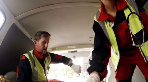 Paramedic using an external defibrillato... | Stock Video | Pond5