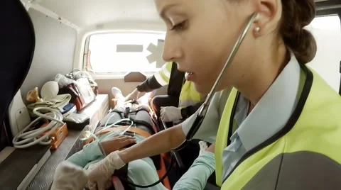 Paramedic using an external defibrillato... | Stock Video | Pond5