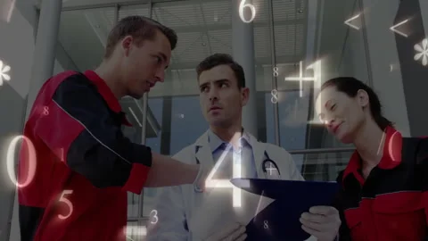 Paramedics and doctor studying chart visualizing data with numeric symbols Stock Footage 311039543