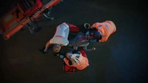 Paramedics Arrive to Help Young Man on a Street Stock-Footage 141574452
