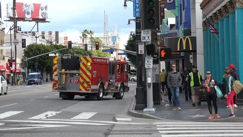 Paramedics assisting a man that has collapsed on the Walk of Fame Video stock 129001687