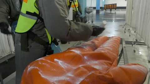 Paramedics dressing protective suits against chemical substances Stock Footage 81441598