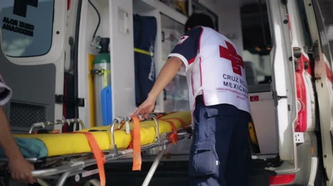 Paramedics folding a stretcher Stockbeeldmateriaal 39561378