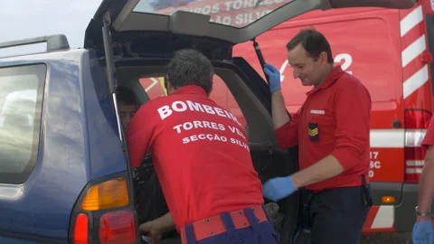 Paramedics helping and talking to Sergio Cosme after quad bike accident Stock Footage 148489625