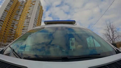 Paramedics inside ambulance auto moving on street, frontal view of windshield 動画素材 245221372
