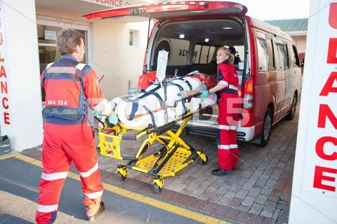Paramedics Lifting Patient From Ambulance