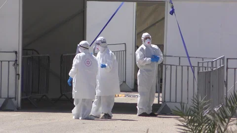 Paramedics of MDA wearing protective gear, waiting for Coronavirus test samples Video stock 128030438