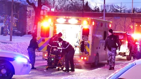 Paramedics performing CPR in freezing temperatures Stock Footage 77884609