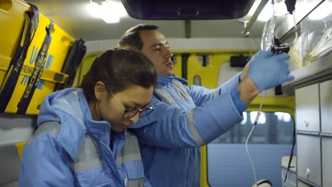 Paramedics Posing inside Ambulance Stock Footage 123691805