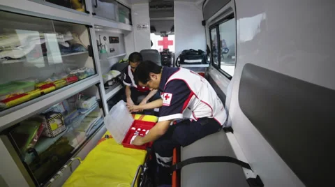 Paramedics preparing equipment Stock Footage 34653635