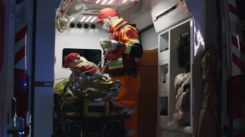 Paramedics preparing equipment in van Video stock 166141511