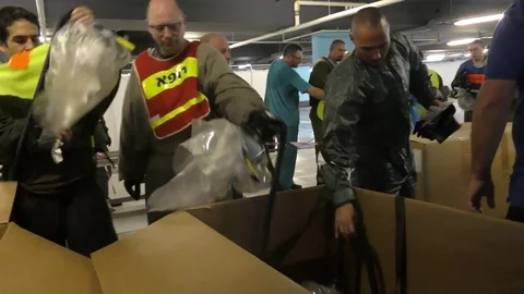 Paramedics with protective suit return their gear 스톡 동영상 81448006