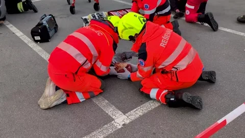 Paramedics Provide Immediate First Aid to Injured Child at Accident Scene Video stock 328619828