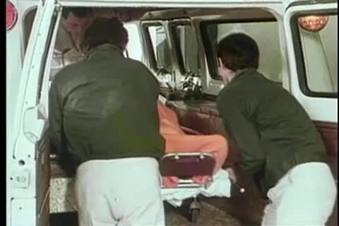 Paramedics removing patient from ambulance Stock Footage 11366087