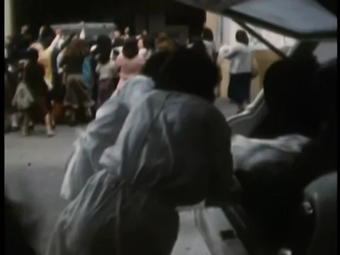 Paramedics run towards crowd with stetcher Video stock 260252156