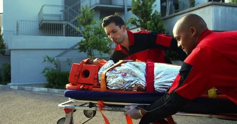 Paramedics rushing a patient in emergency Stock Footage 77828102