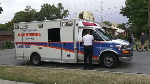 Paramedics on the scene after an explosion leveled a house Stock Footage 71951751
