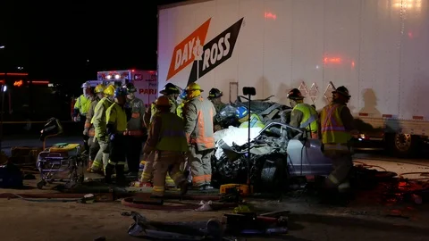 Paramedics Strapping Down Patient During Extrication - 24fps 1080p Video stock 91563370