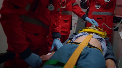 Paramedics team reacting quick to provide medical help to injured patient Stock Footage 166885842