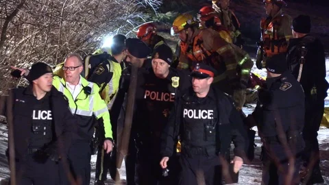 Paramedics try to rush and revive drowning victim on stretcher to ambulance Stock Footage 100657435
