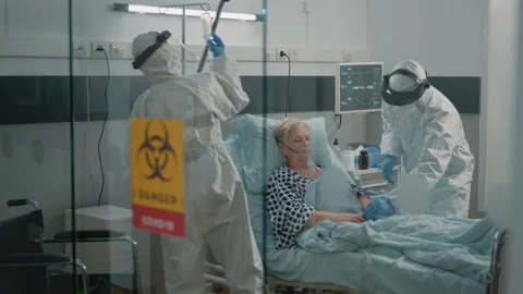 Paramedics wearing protection in lockdown zone at clinic Stock Footage 162904984