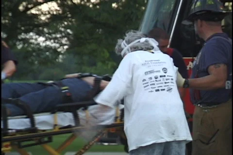 Paramedics Working on Accident Scene Stock Footage 298022